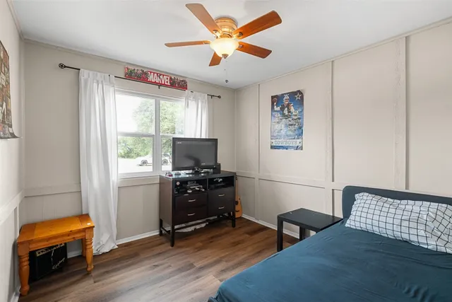 a bedroom with furniture and a window