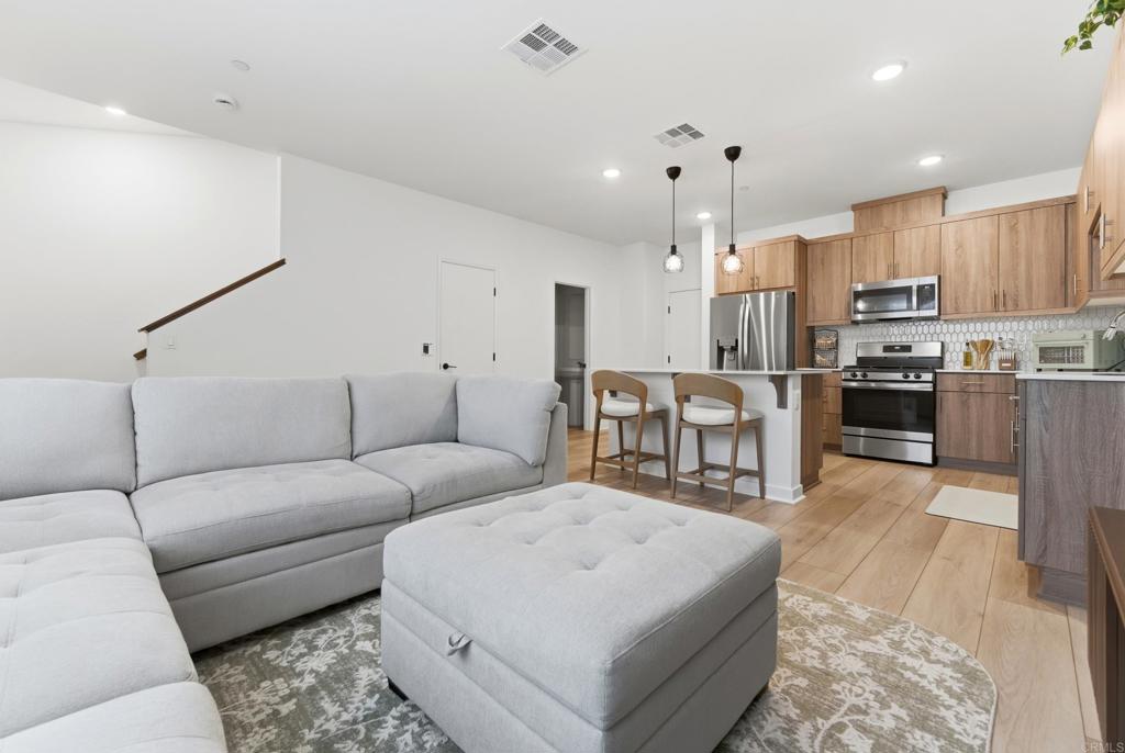 35172 Rangpur Lane Fallbrook, CA 92028 - Photo 1 of 47 a living room with furniture and kitchen view