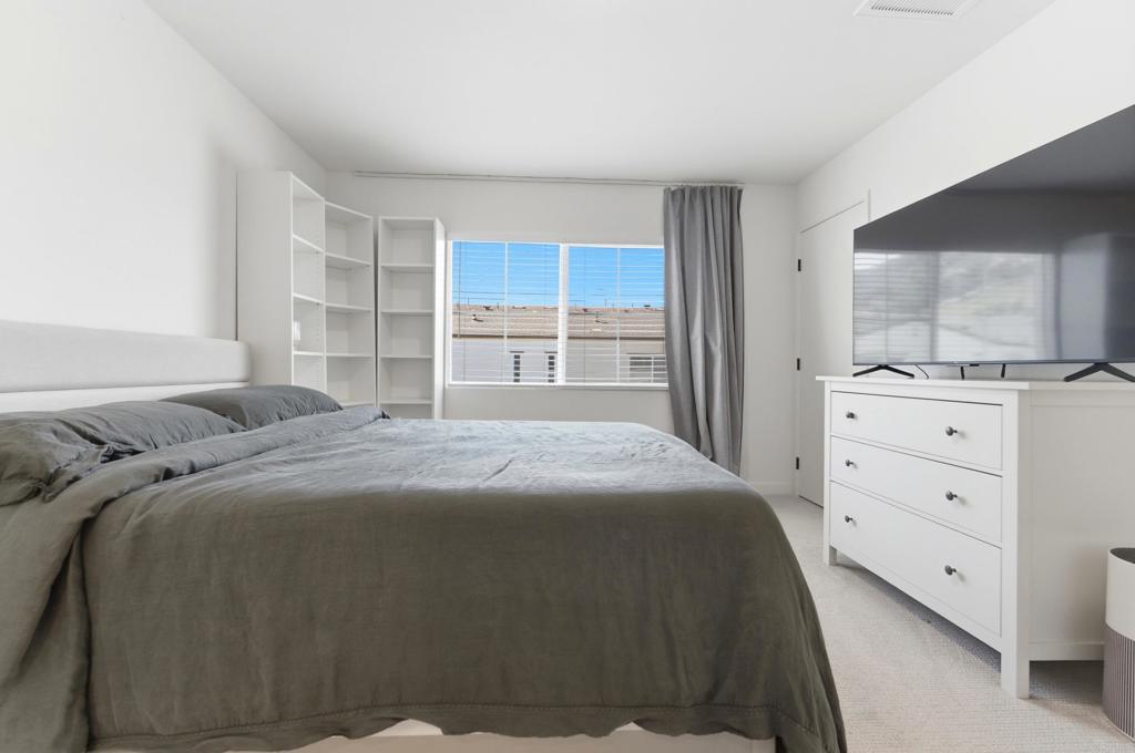 35172 Rangpur Lane Fallbrook, CA 92028 - Photo 20 of 47 a bedroom with a bed and a flat tv screen in it