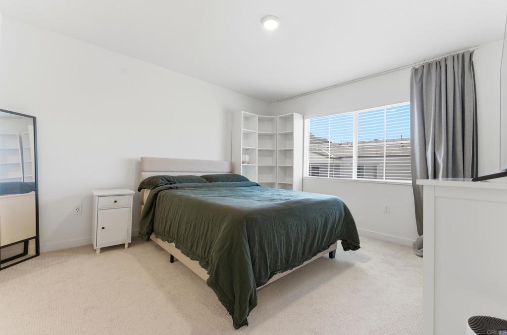 35172 Rangpur Lane Fallbrook, CA 92028 - Photo 21 of 47 a bed sitting in a spacious bedroom next to a window