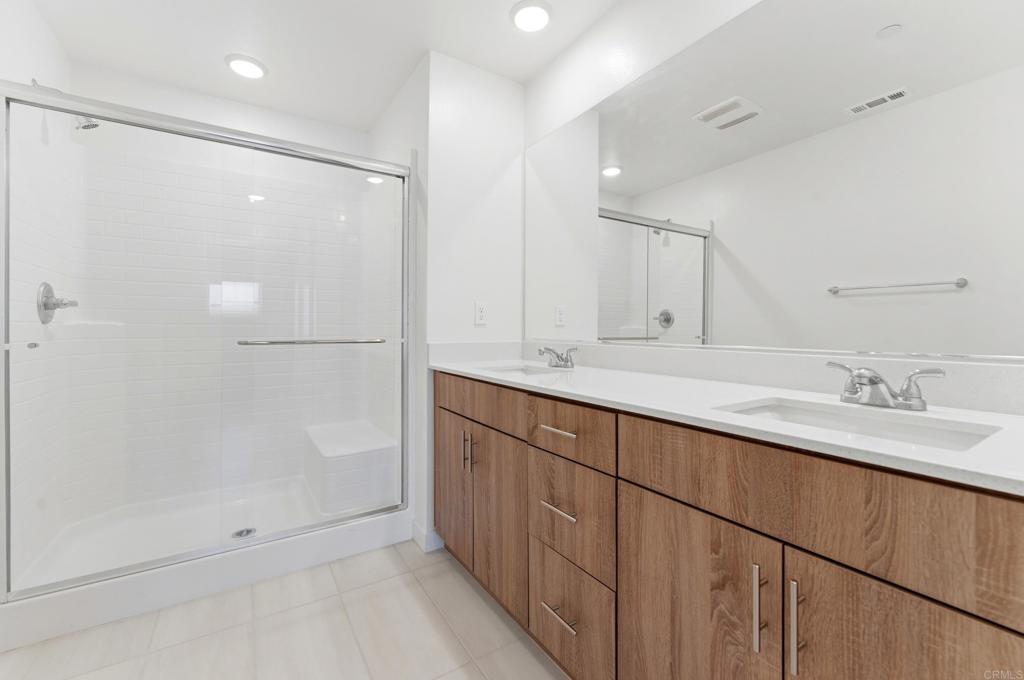 35172 Rangpur Lane Fallbrook, CA 92028 - Photo 26 of 47 a bathroom with double sink and a mirror