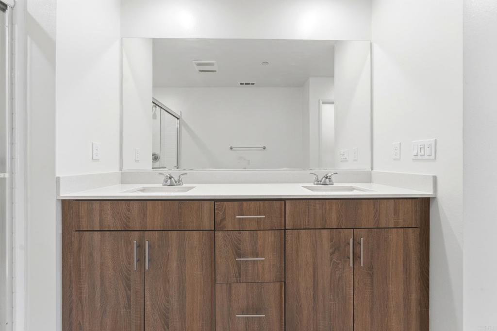 35172 Rangpur Lane Fallbrook, CA 92028 - Photo 28 of 47 a bathroom with a sink and mirror