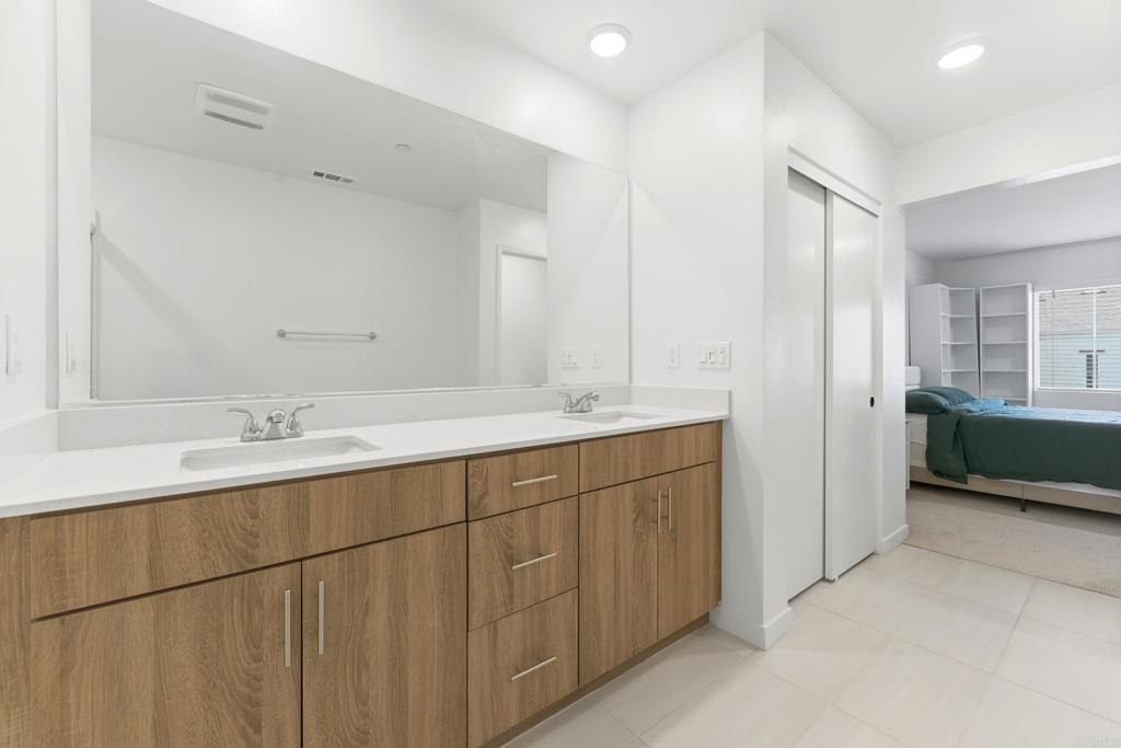 35172 Rangpur Lane Fallbrook, CA 92028 - Photo 29 of 47 a bathroom with double sink and mirror