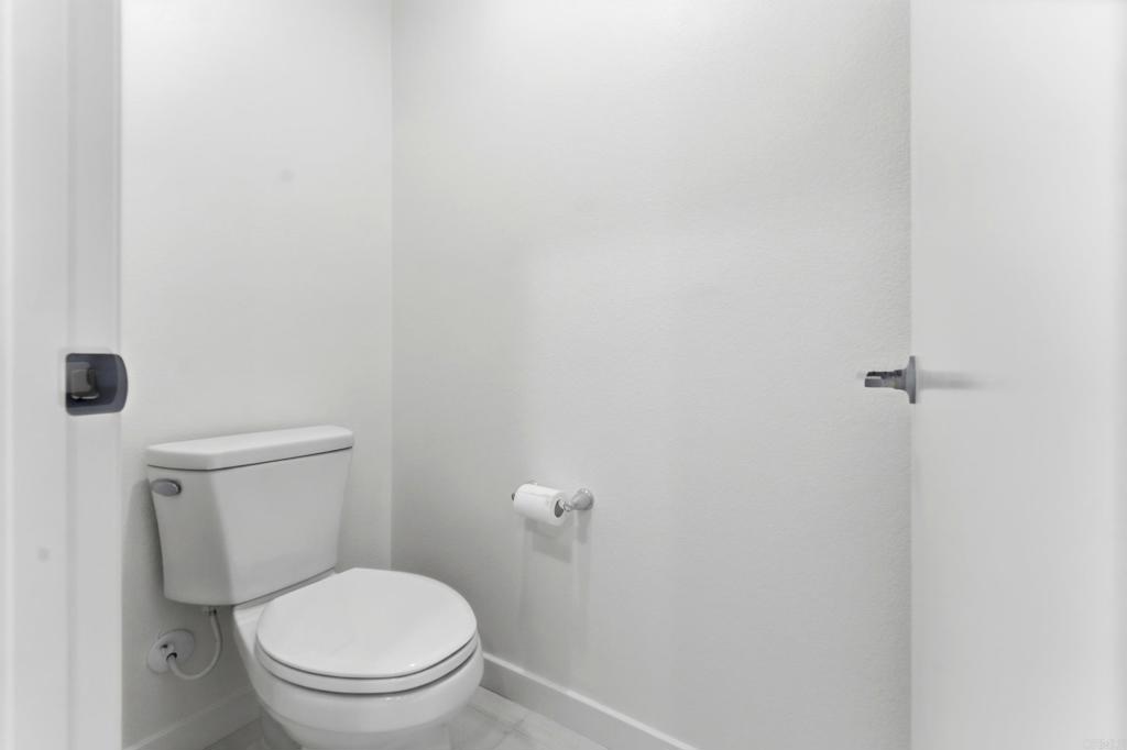 35172 Rangpur Lane Fallbrook, CA 92028 - Photo 30 of 47 a white toilet sitting next to a white wall