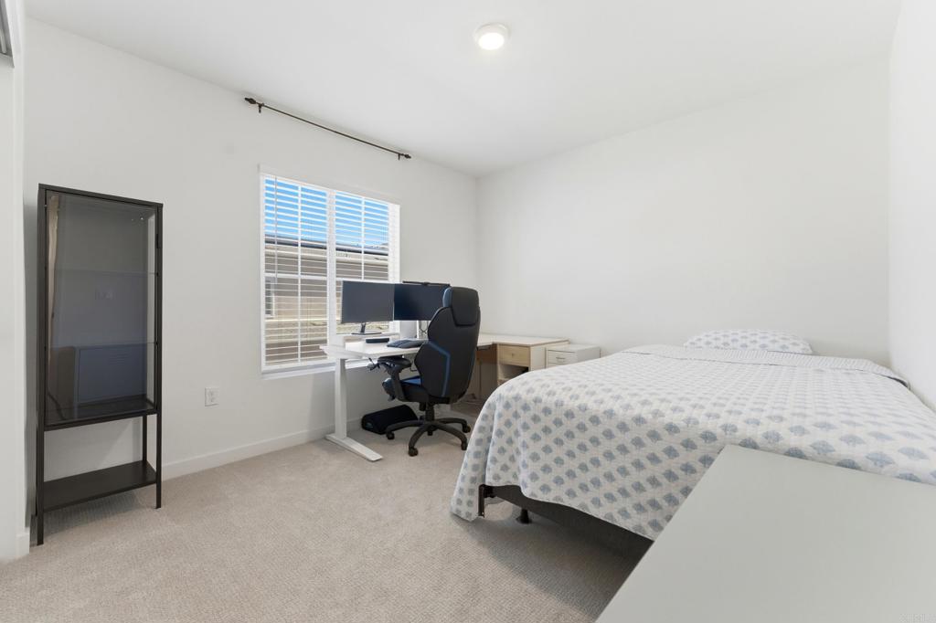 35172 Rangpur Lane Fallbrook, CA 92028 - Photo 32 of 47 a bedroom with a bed and a window