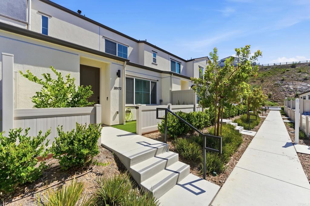 35172 Rangpur Lane Fallbrook, CA 92028 - Photo 40 of 47 a view of a house with potted plants