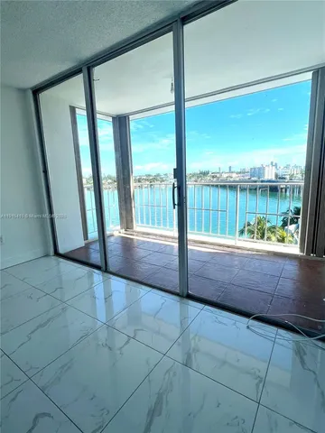 a view of room with window and floor to ceiling window