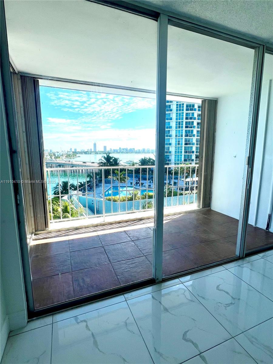 1865 79th Street Causeway, Unit 7I North Bay Village, FL 33141 - Photo 18 of 40 a view of room with window and floor to ceiling window