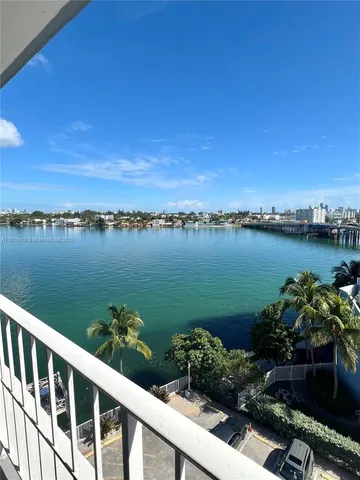 a view of a balcony with an ocean