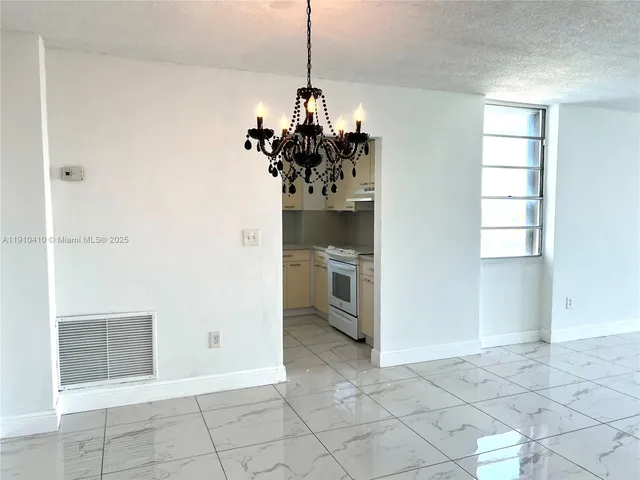 a kitchen with stainless steel appliances white cabinets and a sink