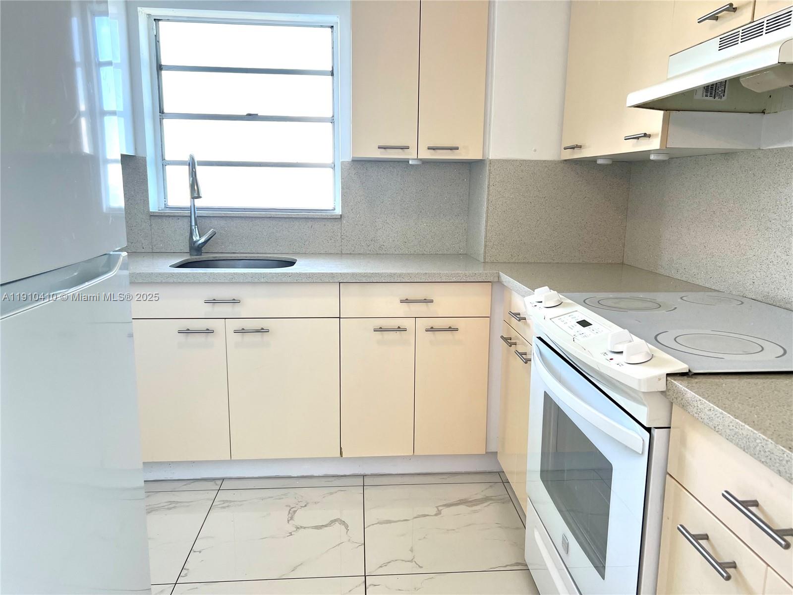 1865 79th Street Causeway, Unit 7I North Bay Village, FL 33141 - Photo 31 of 40 a utility room with cabinets washer and dryer