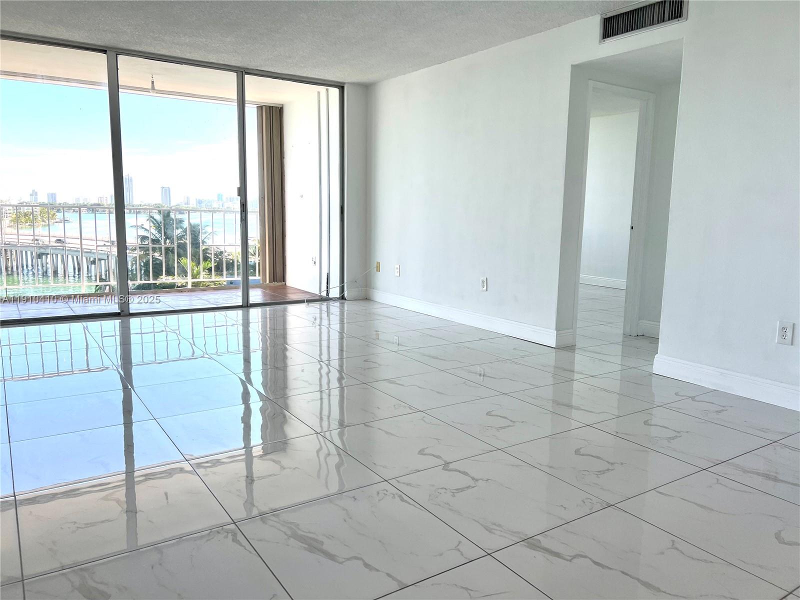 1865 79th Street Causeway, Unit 7I North Bay Village, FL 33141 - Photo 35 of 40 a view of an empty room and floor to ceiling window