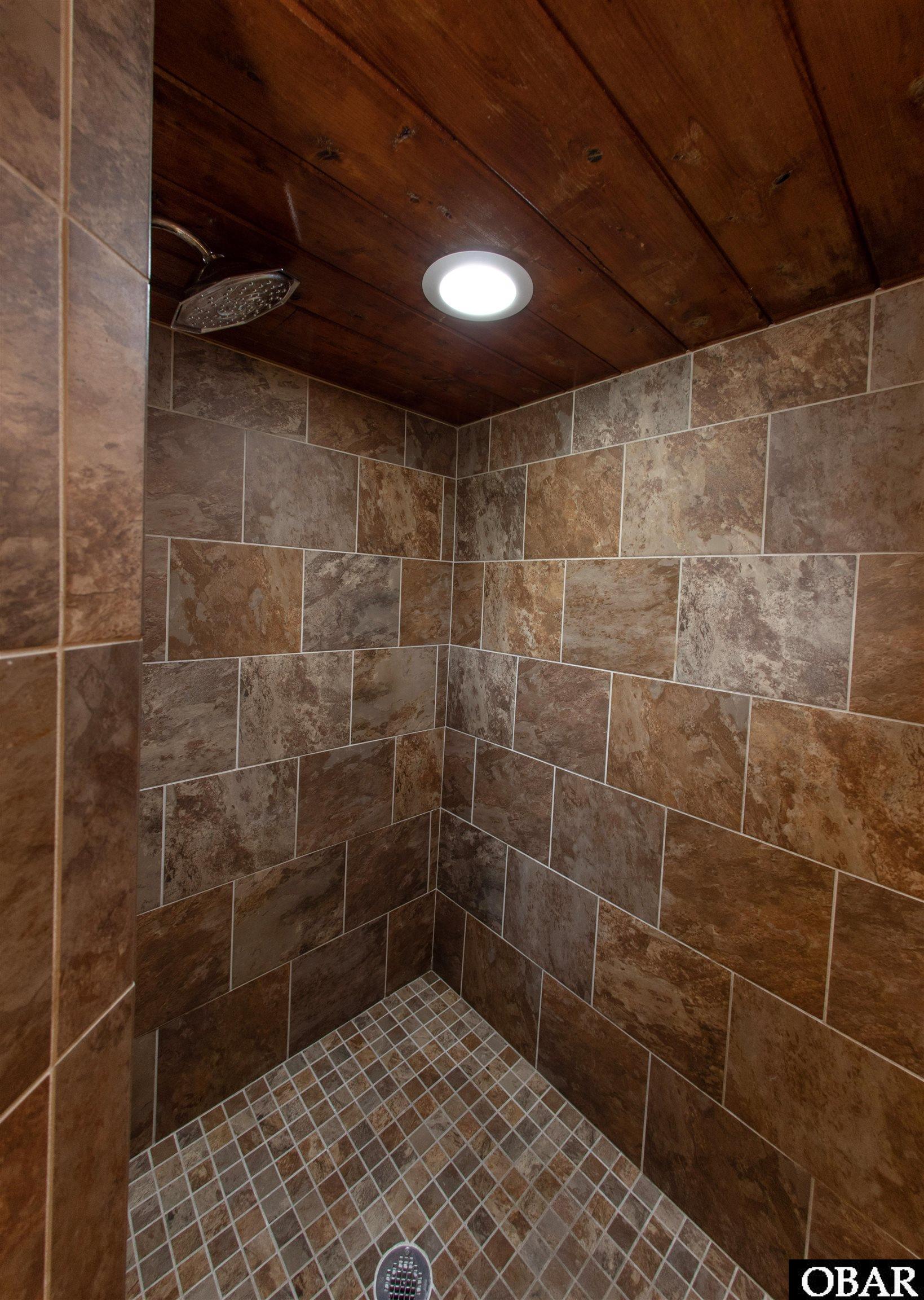 41 Skyline Road, Unit 1 Southern Shores, NC 27949 - Photo 25 of 58 Spacious tiled shower with rainforest shower head.