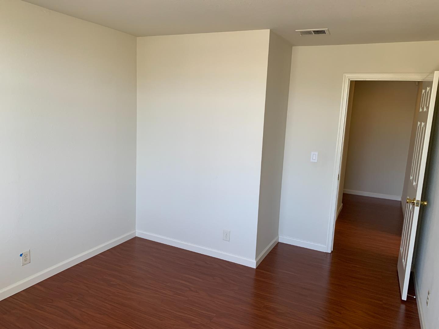 562 Costigan Circle Milpitas, CA 95035 - Photo 12 of 25 a view of an empty room with wooden floor