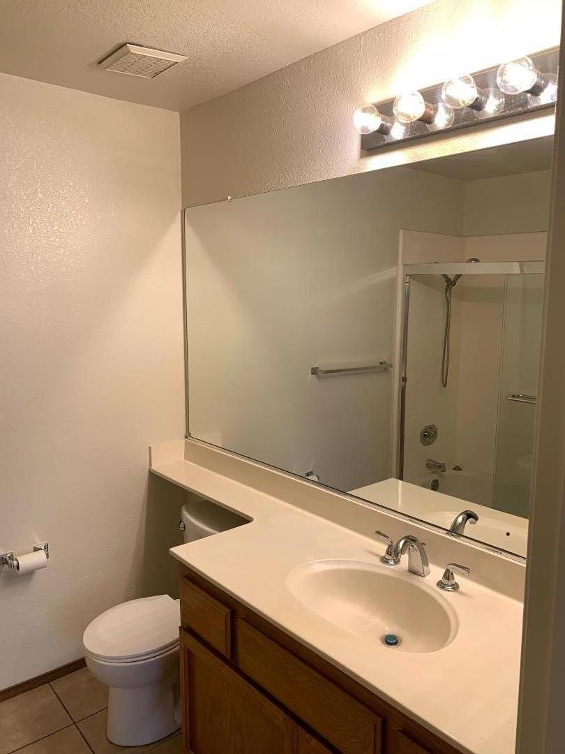 562 Costigan Circle Milpitas, CA 95035 - Photo 14 of 25 a bathroom with a sink toilet and vanity