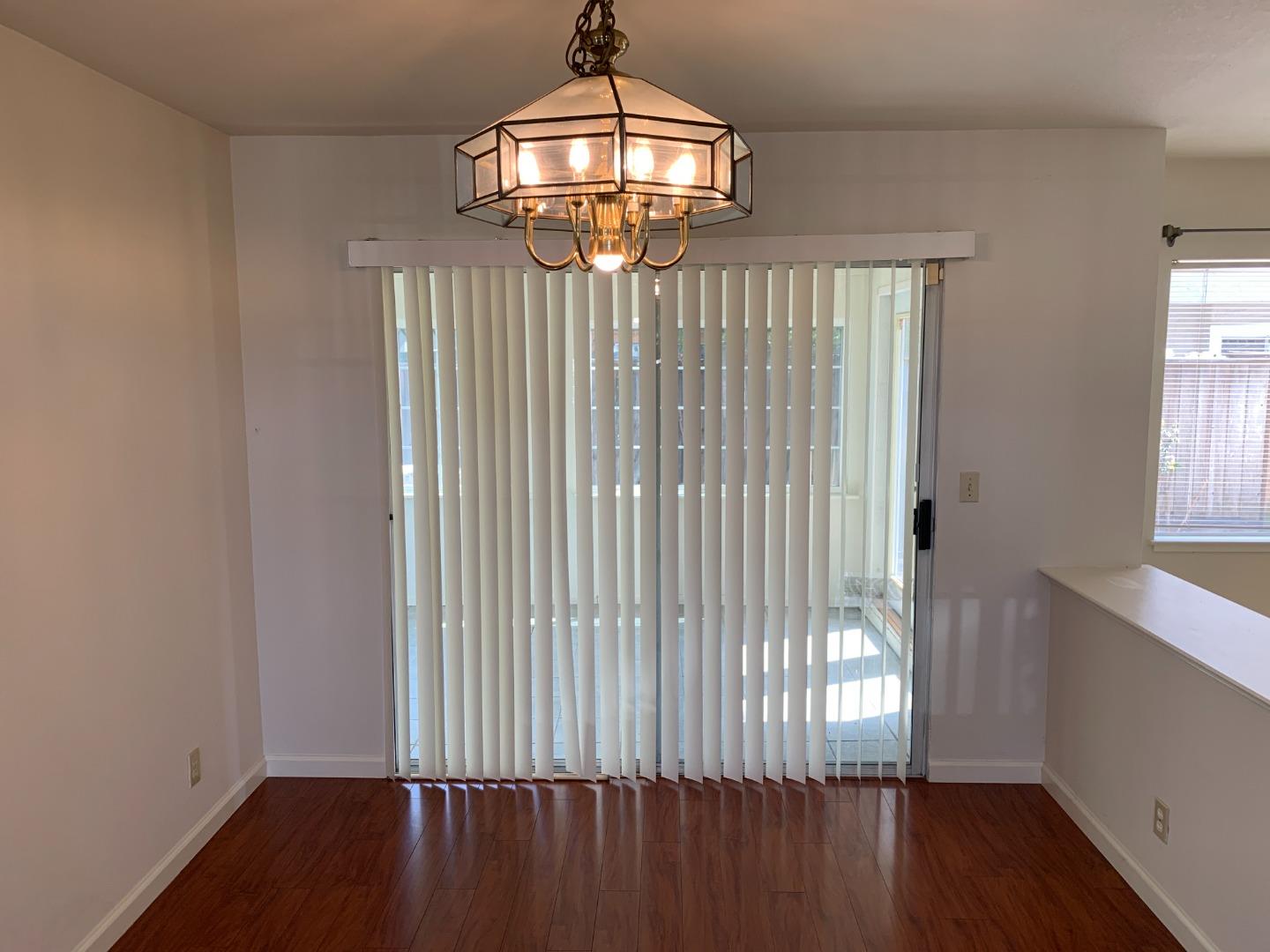 562 Costigan Circle Milpitas, CA 95035 - Photo 17 of 25 wooden floor in an empty room with a window