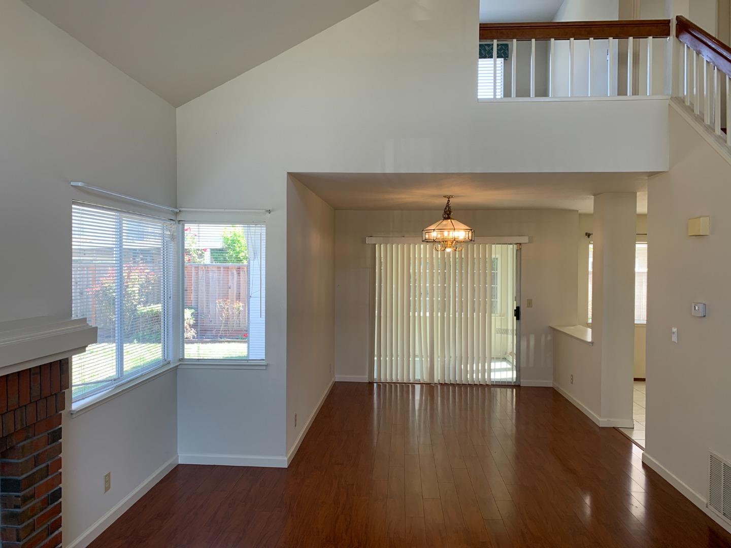 562 Costigan Circle Milpitas, CA 95035 - Photo 4 of 25 a view of an entryway with wooden floor