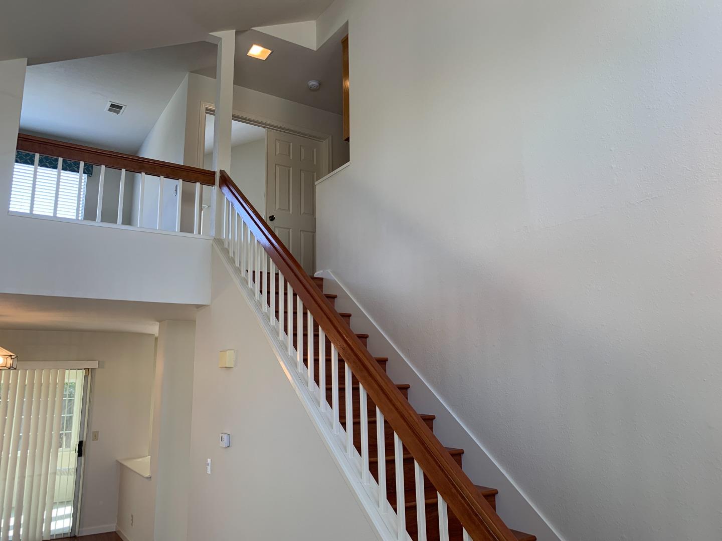 562 Costigan Circle Milpitas, CA 95035 - Photo 6 of 25 a view of staircase with wooden floor and staircase