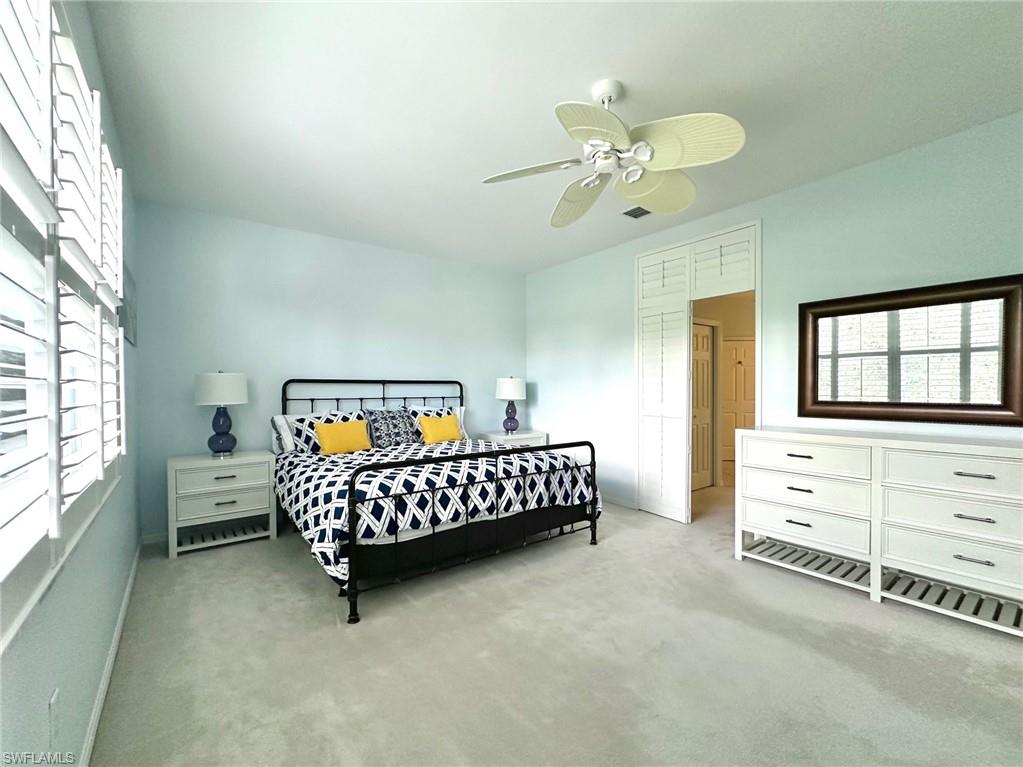 12259 Toscana Way, Unit 202 Bonita Springs, FL 34135 - Photo 18 of 40 a bedroom with a bed and a window