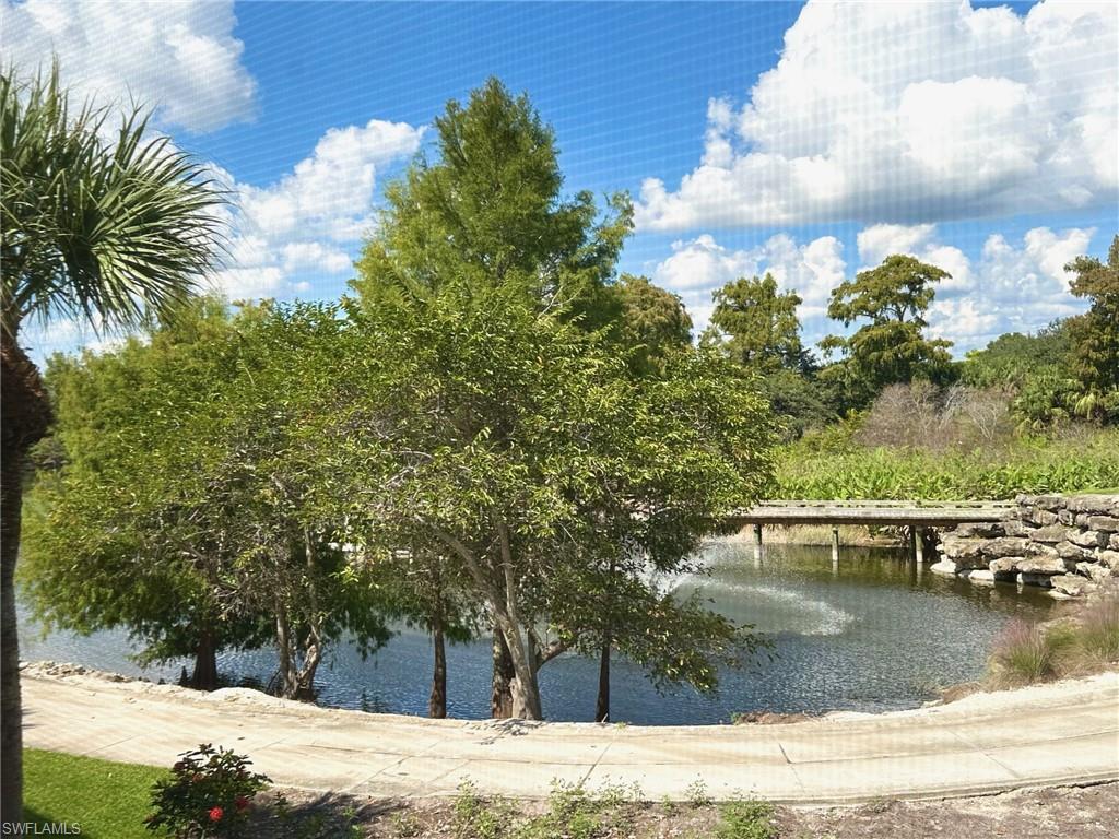 12259 Toscana Way, Unit 202 Bonita Springs, FL 34135 - Photo 23 of 40 a view of a house with a yard