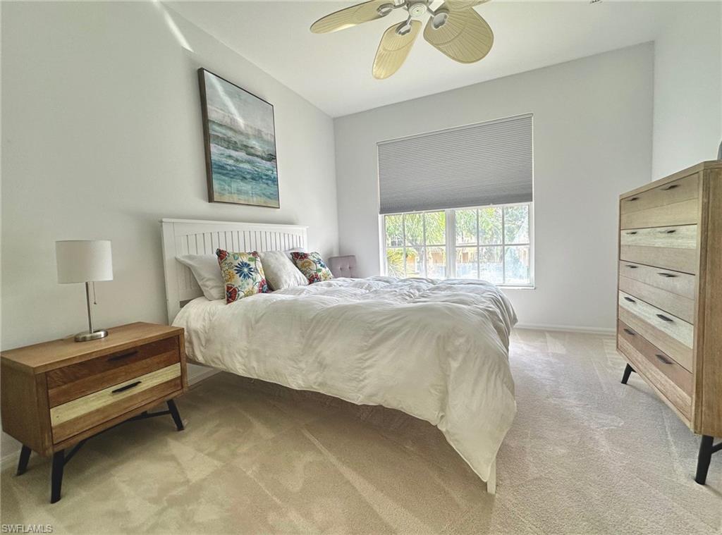 12259 Toscana Way, Unit 202 Bonita Springs, FL 34135 - Photo 29 of 40 a bedroom with a bed and a window