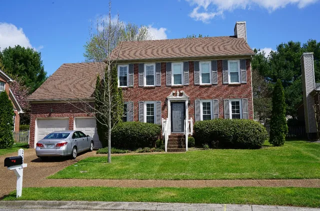 a house view with a garden space