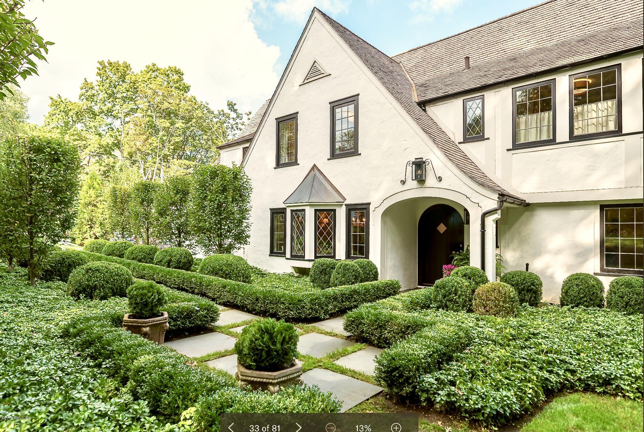 4 Cedar Hill Greenwich, CT 06830 - Photo 1 of 28 a front view of a house with porch and garden