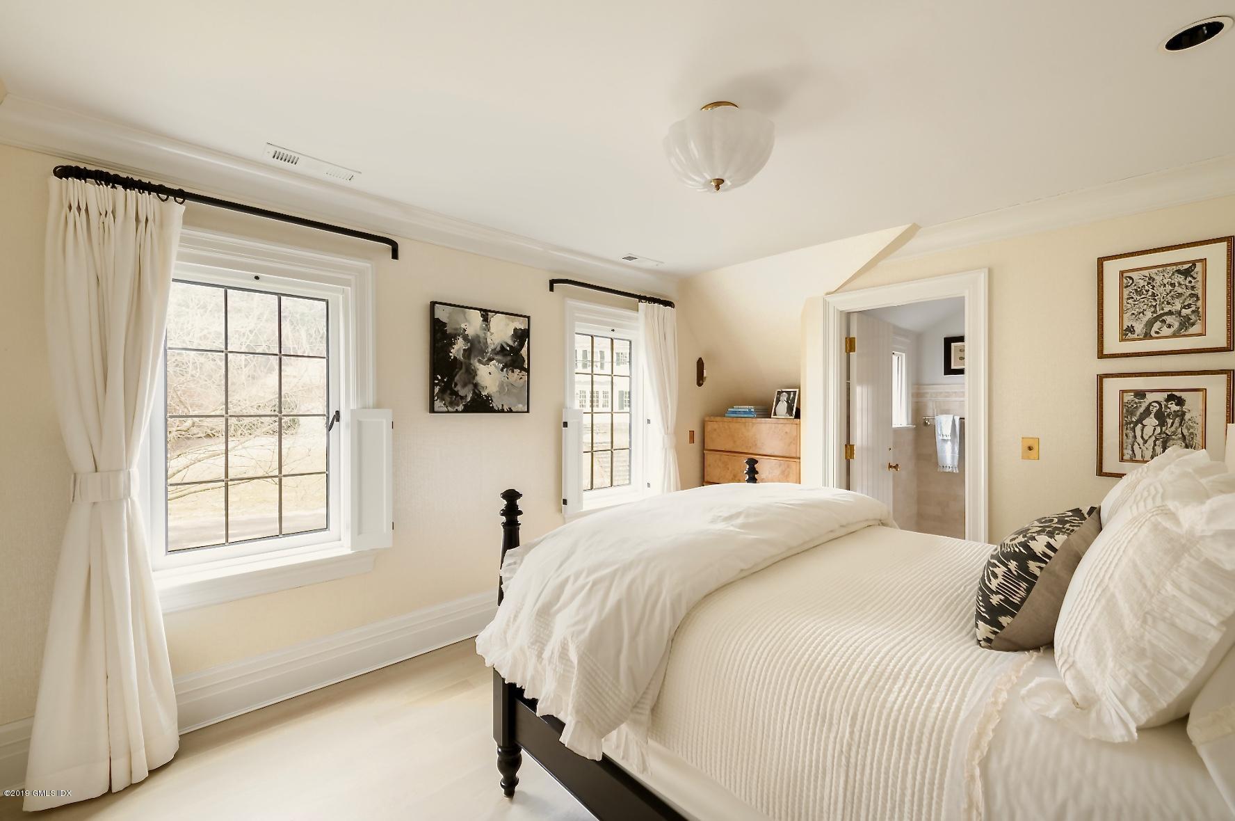 4 Cedar Hill Greenwich, CT 06830 - Photo 12 of 28 a bedroom with a bed and a window