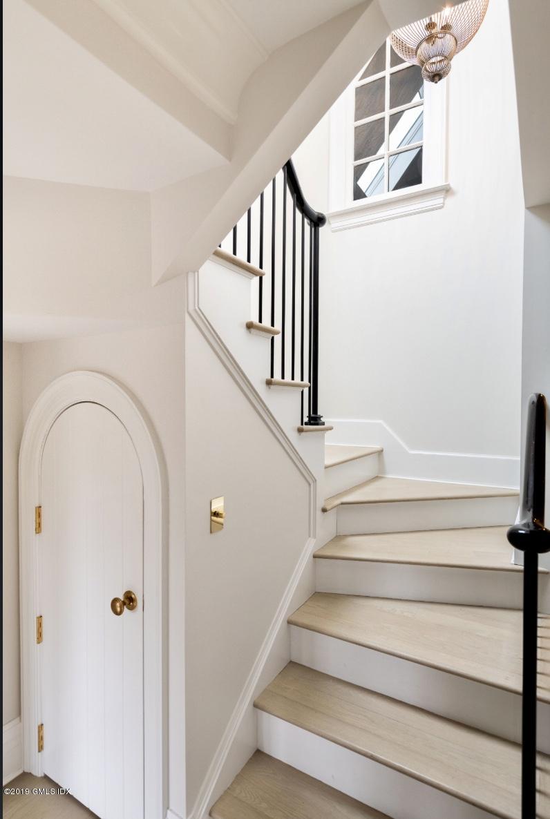 4 Cedar Hill Greenwich, CT 06830 - Photo 15 of 28 a view of staircase with wooden floor and white walls