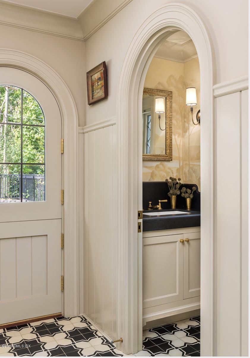 4 Cedar Hill Greenwich, CT 06830 - Photo 16 of 28 a living room with a sink and a window