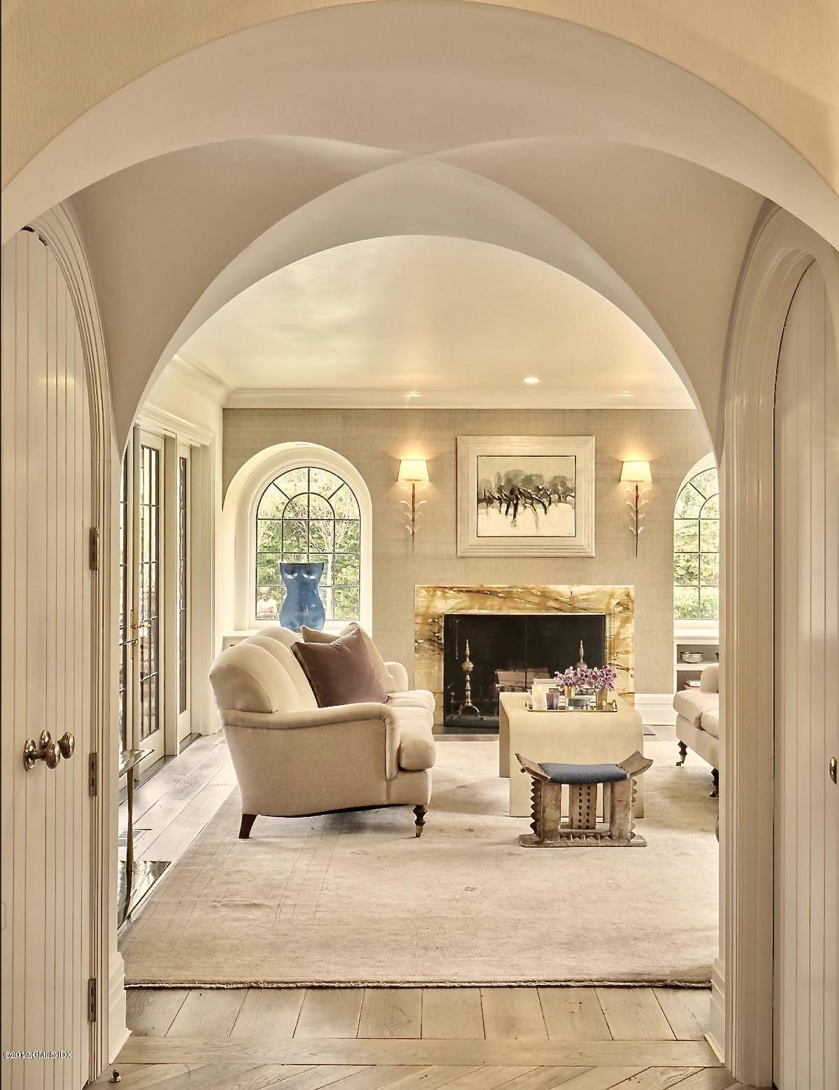 4 Cedar Hill Greenwich, CT 06830 - Photo 2 of 28 a living room with furniture and a fireplace