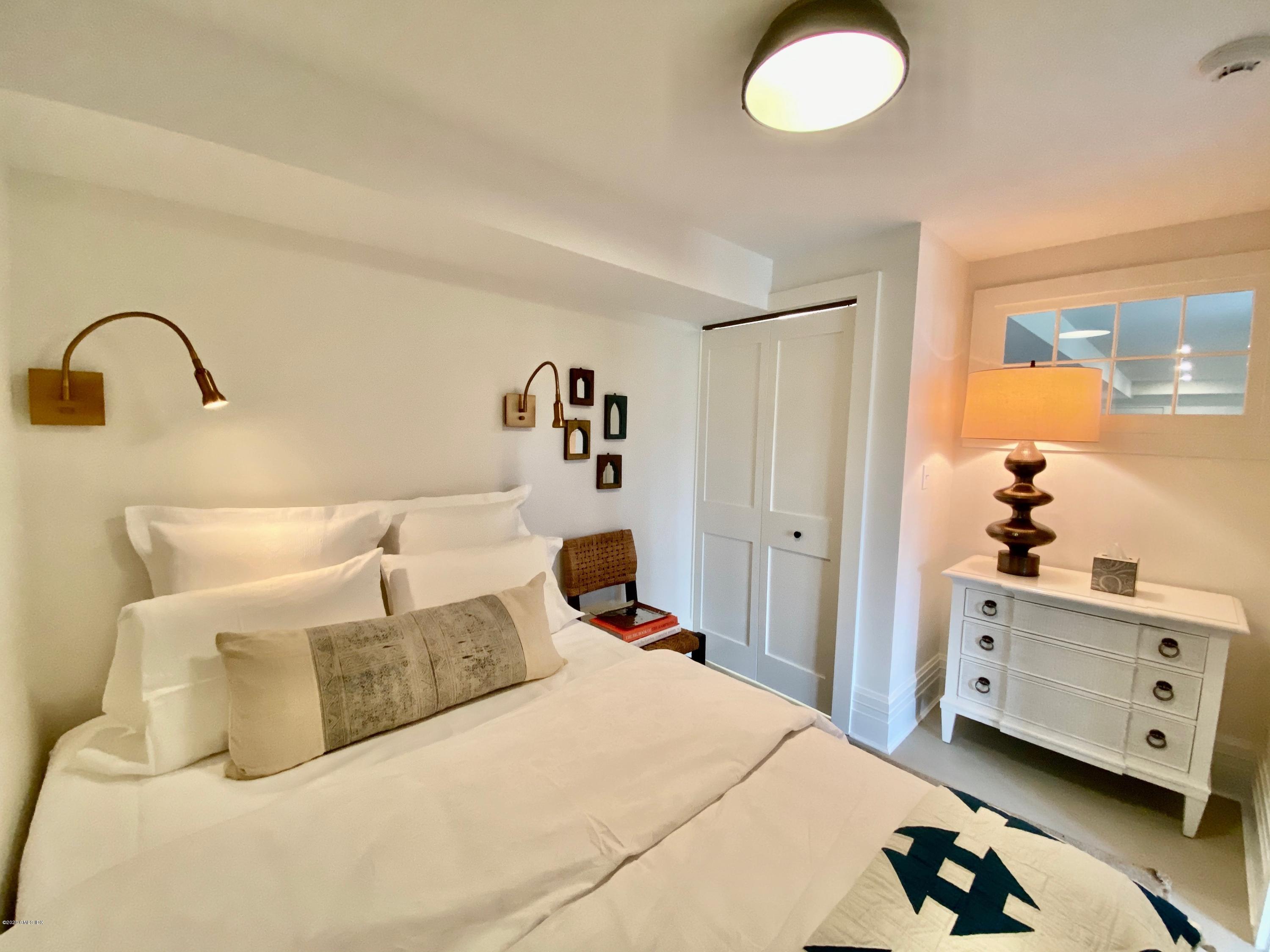 4 Cedar Hill Greenwich, CT 06830 - Photo 21 of 28 a bedroom with a bed and a window