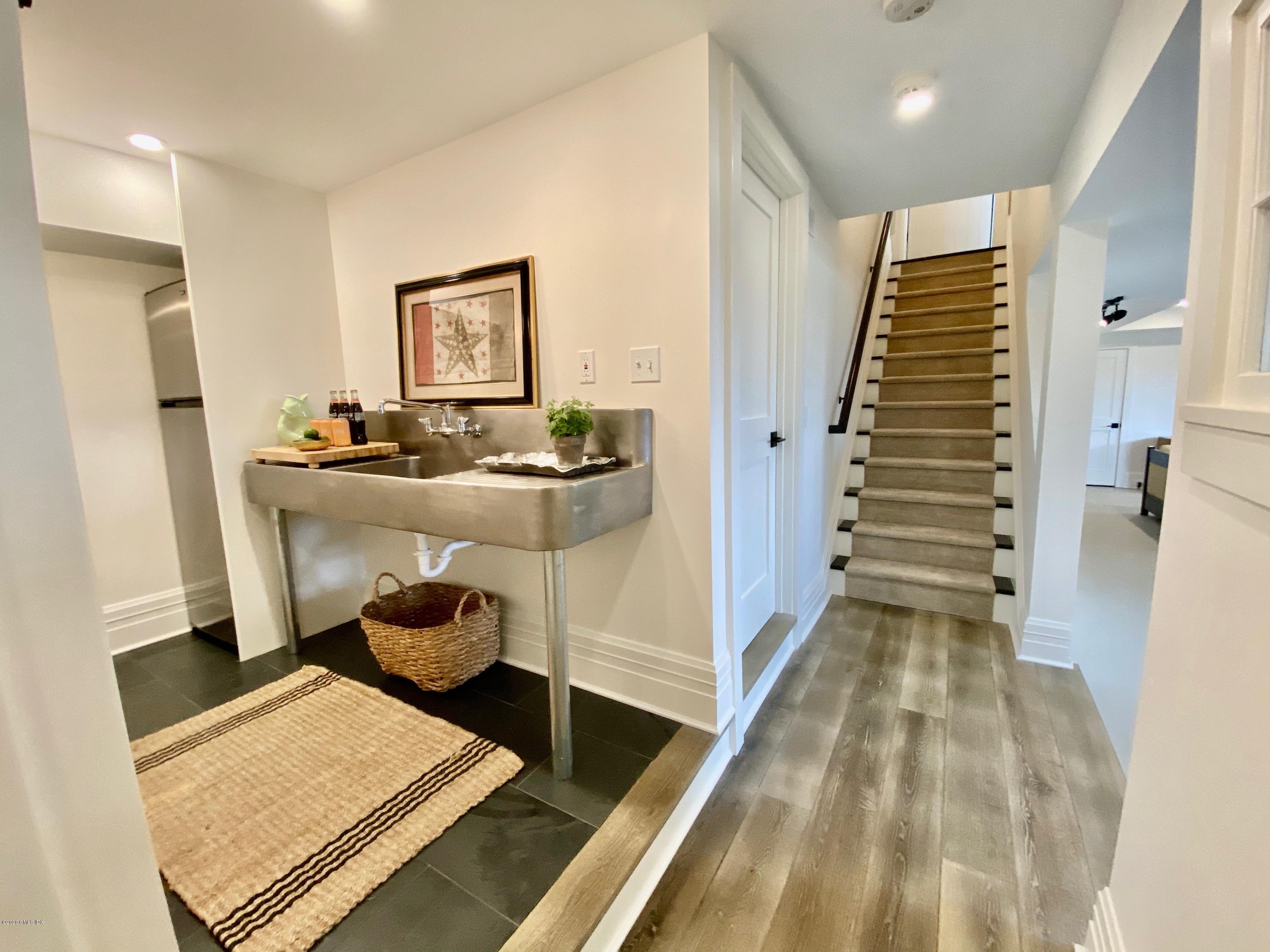 4 Cedar Hill Greenwich, CT 06830 - Photo 24 of 28 a room with furniture and wooden floor