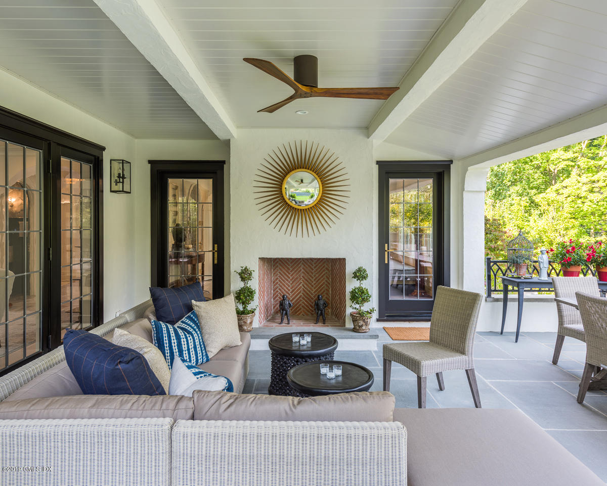 4 Cedar Hill Greenwich, CT 06830 - Photo 25 of 28 a living room with furniture and a large window