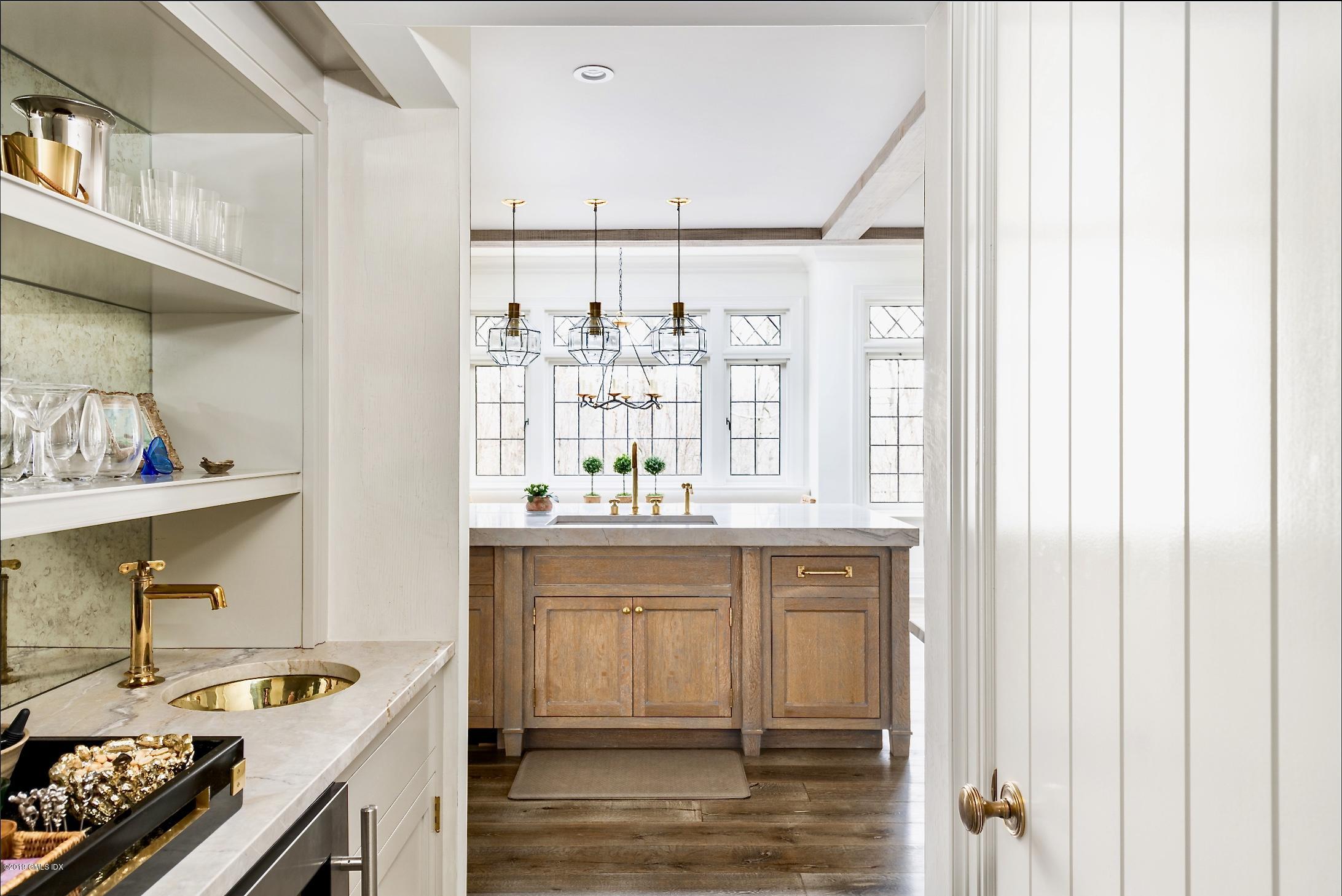 4 Cedar Hill Greenwich, CT 06830 - Photo 5 of 28 a kitchen with stainless steel appliances granite countertop a sink stove and cabinets
