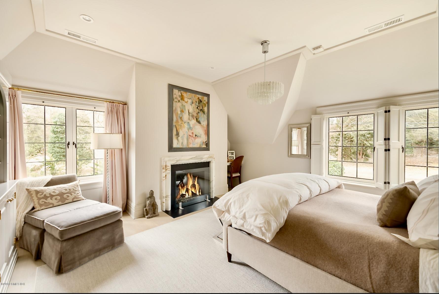 4 Cedar Hill Greenwich, CT 06830 - Photo 9 of 28 a bedroom with a bed and a couch