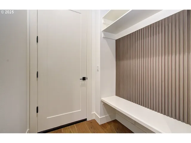 a bathroom with a toilet a sink a tub and mirror