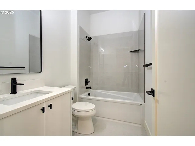 a view of a kitchen with a sink and a window