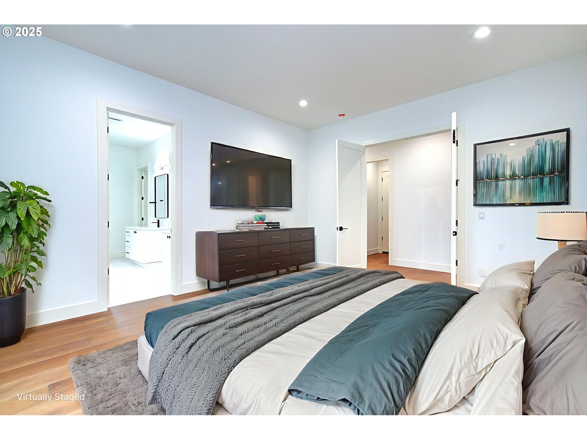 2010 Northeast 159th Street Ridgefield, WA 98642 - Photo 34 of 42 a bedroom with a bed and a flat screen tv