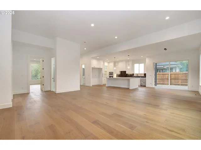 a view of a kitchen with a sink and a window