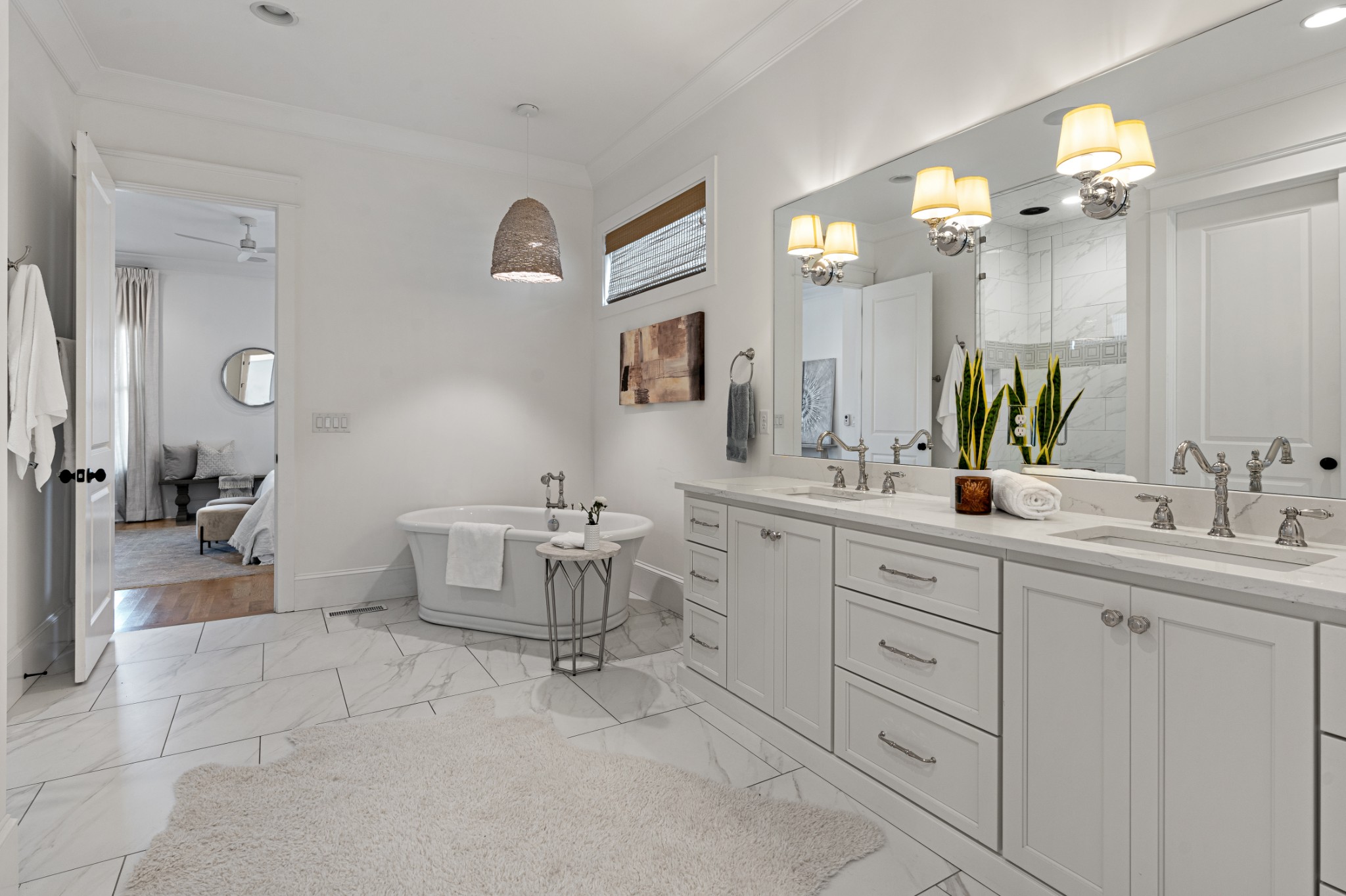 110 Lindsley Park Drive Nashville, TN 37206 - Photo 14 of 32 a spacious bathroom with a double vanity sink a mirror and a bathtub