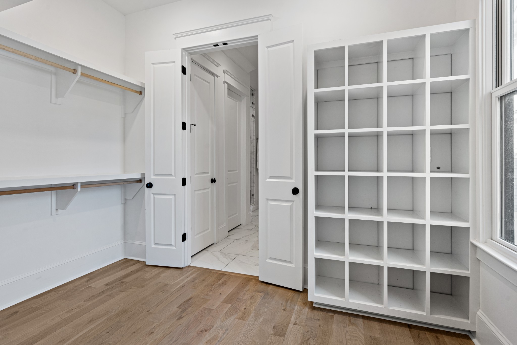 110 Lindsley Park Drive Nashville, TN 37206 - Photo 16 of 32 a view of an empty room with wooden floor and a window