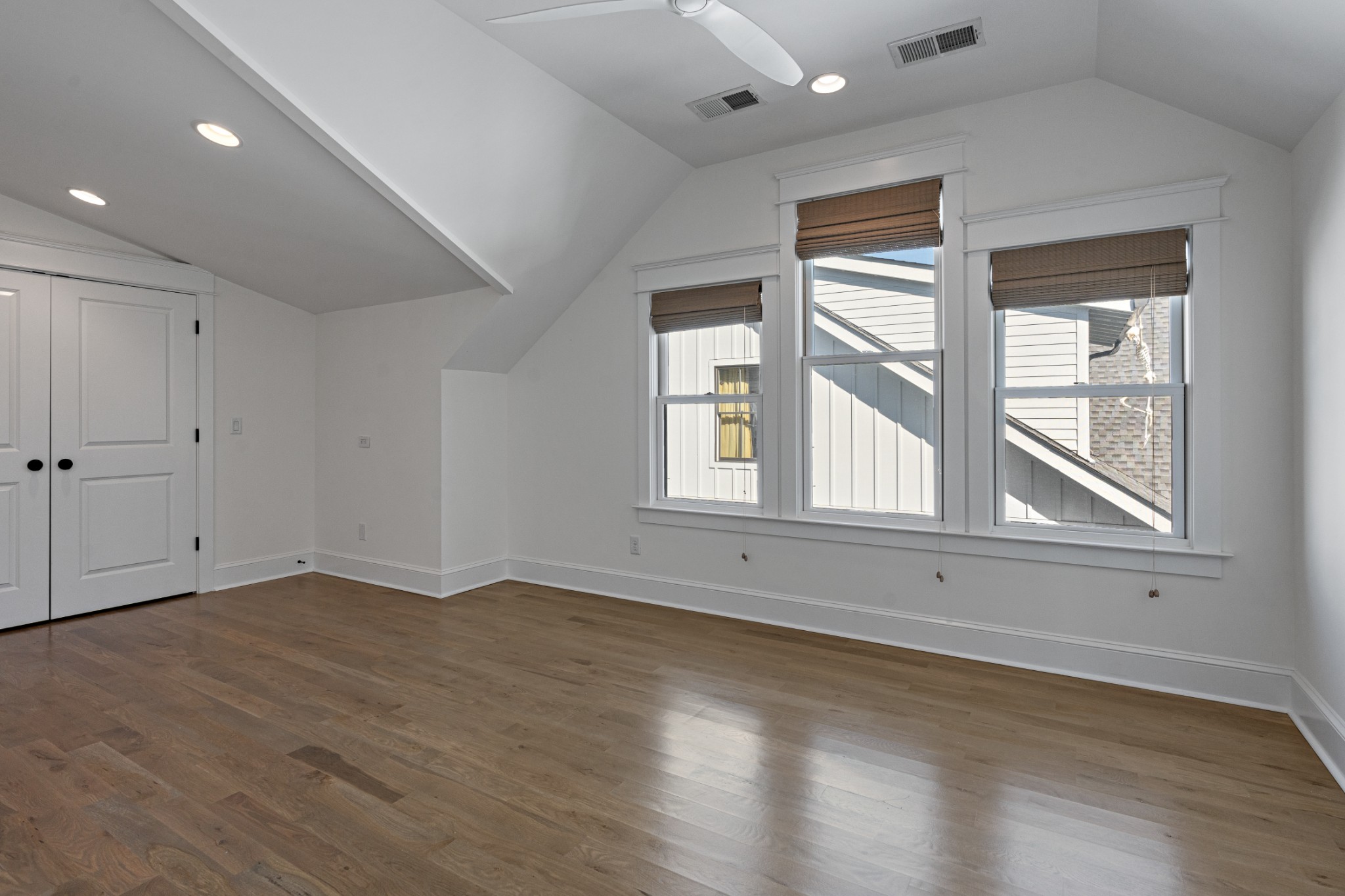 110 Lindsley Park Drive Nashville, TN 37206 - Photo 20 of 32 an empty room with wooden floor and windows