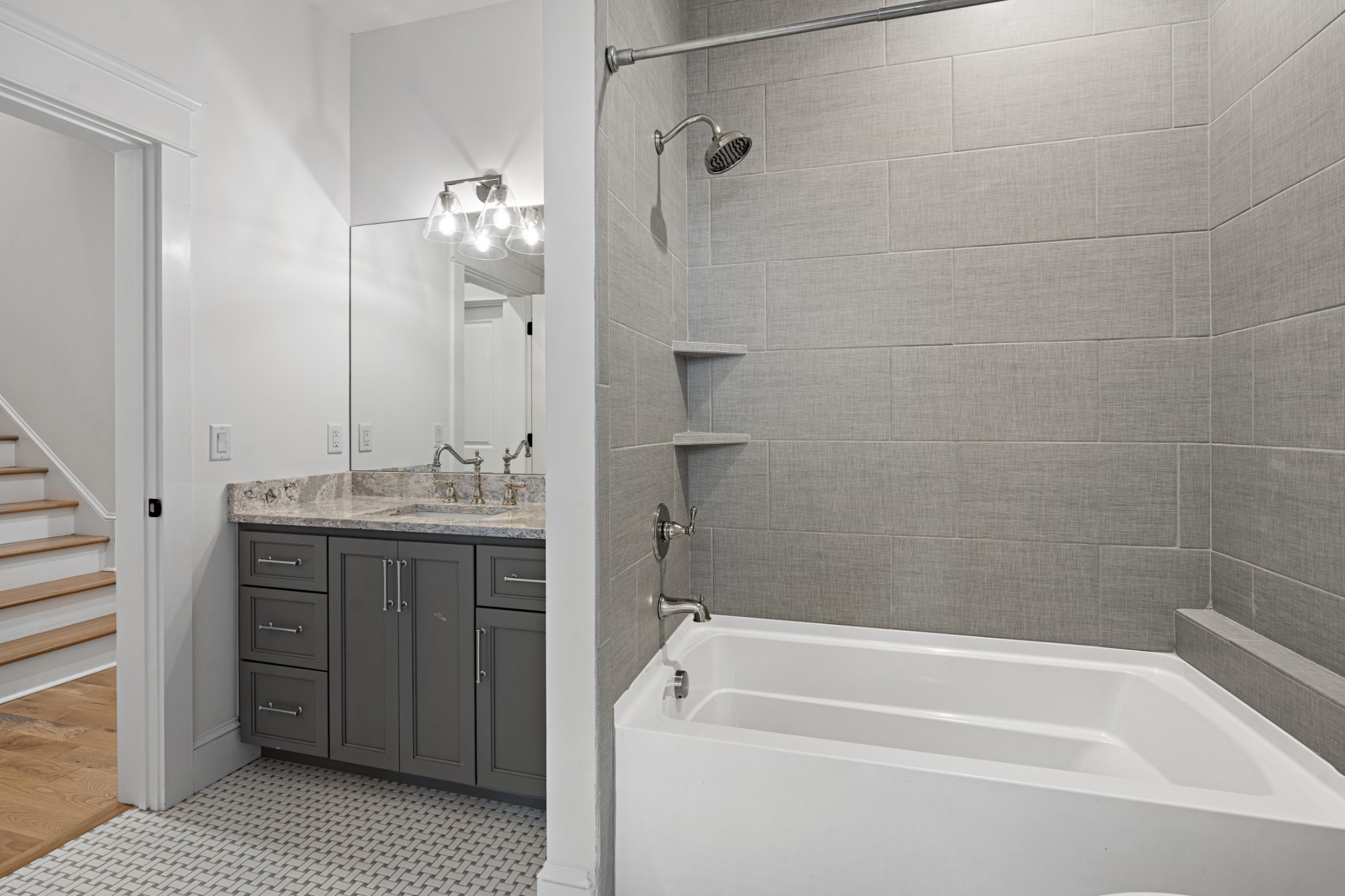 110 Lindsley Park Drive Nashville, TN 37206 - Photo 26 of 32 a bathroom with a granite countertop sink a toilet and shower