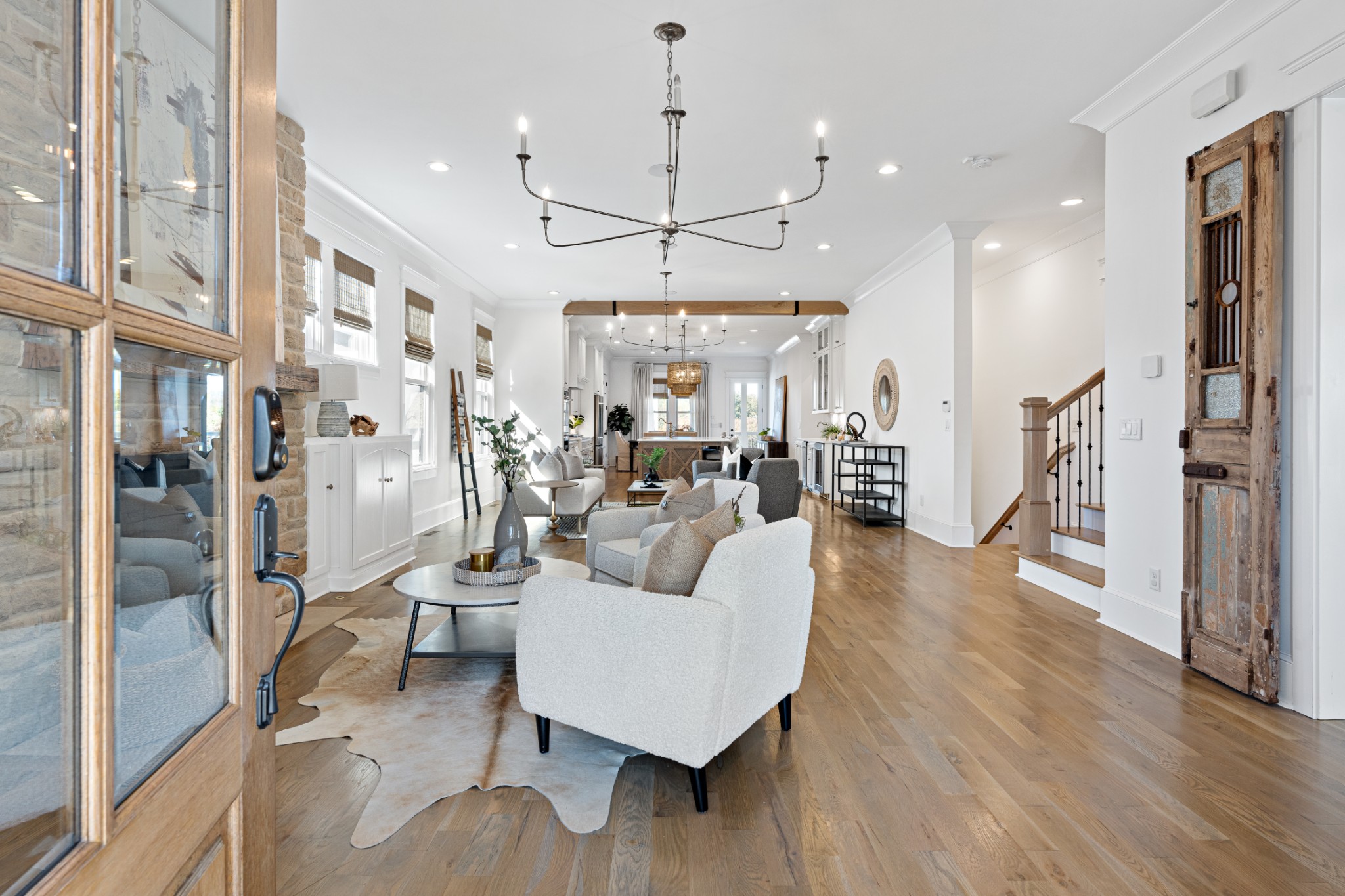 110 Lindsley Park Drive Nashville, TN 37206 - Photo 3 of 32 a living room with furniture a wooden floor and a chandelier
