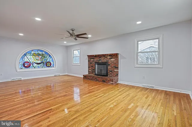 a large kitchen with kitchen island a sink stainless steel appliances and cabinets