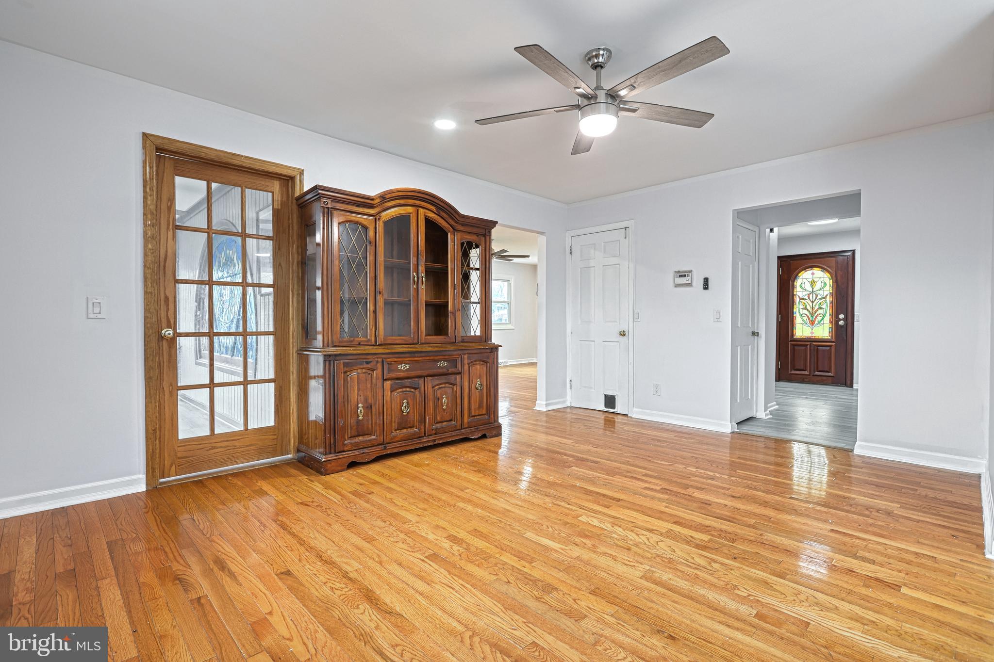 1373 Quail Hollow Road Harrisburg, PA 17112 - Photo 17 of 68 a view of an empty room with a window and wooden floor