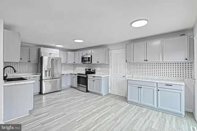 a view of a livingroom with closet and cabinet