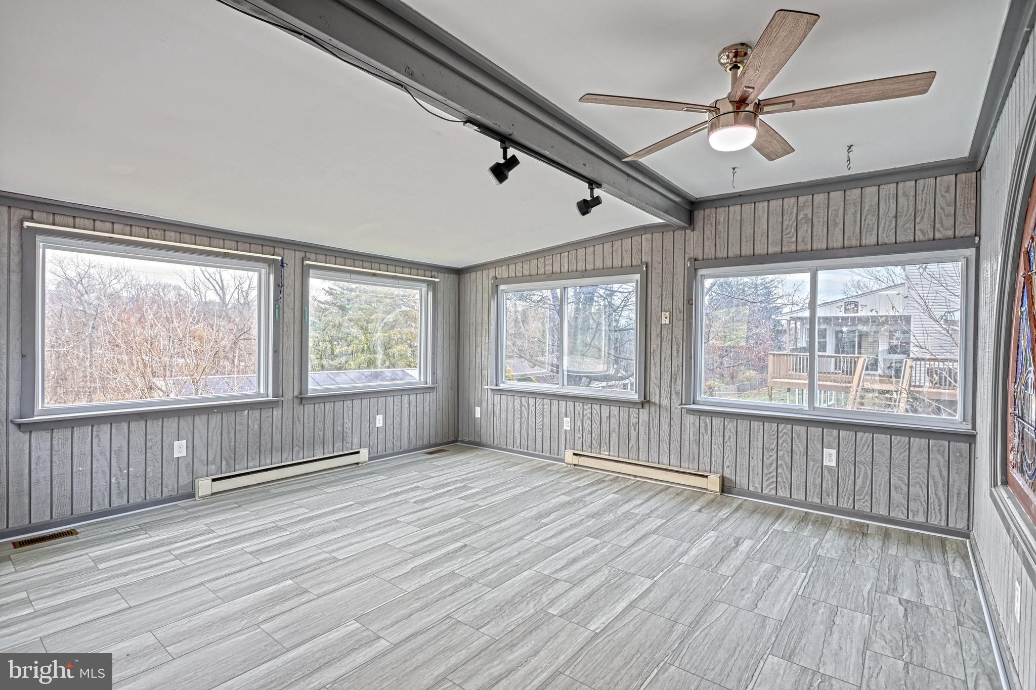 1373 Quail Hollow Road Harrisburg, PA 17112 - Photo 25 of 68 a view of an empty room with wooden floor and a window