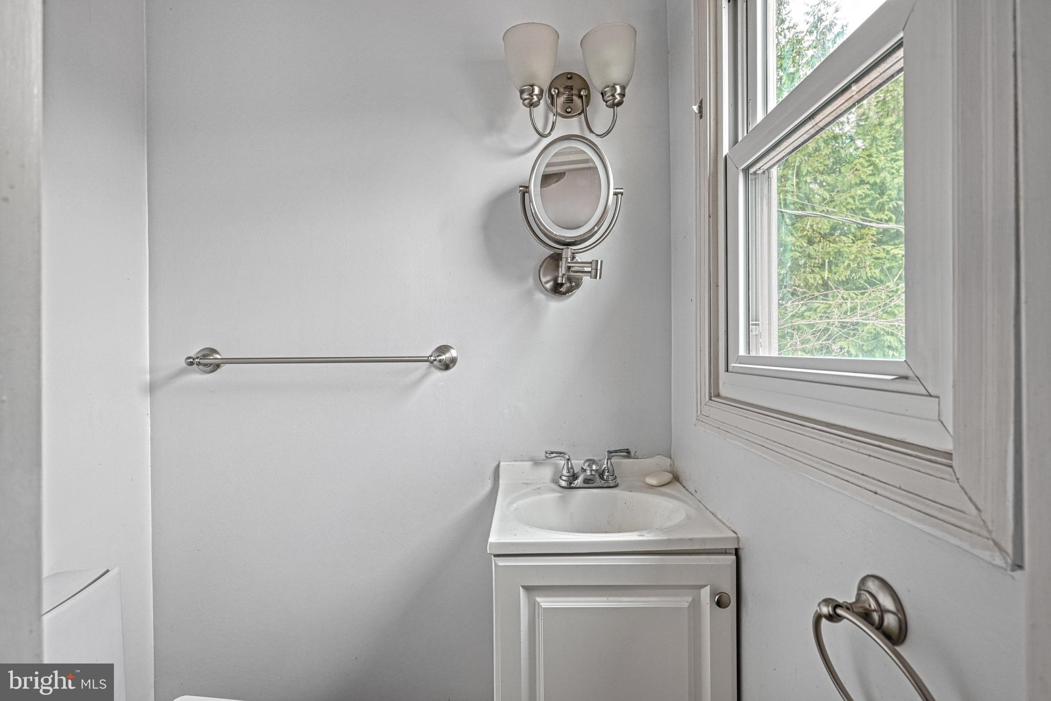 1373 Quail Hollow Road Harrisburg, PA 17112 - Photo 28 of 68 a bathroom with a sink a washer and dryer